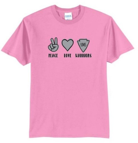A pink t-shirt with black text on itDescription automatically generated with medium confidence